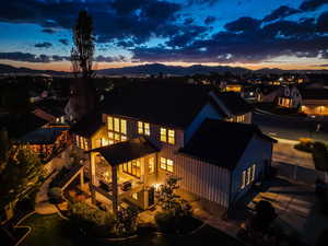 Back of house at dusk with a mountain view