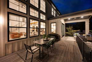 Deck at twilight featuring outdoor dining space