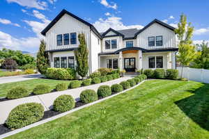 Modern farmhouse with a porch and board and batten siding