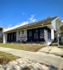 View of front facade featuring brick siding