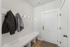 Mudroom featuring light wood finished floors