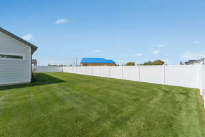 View of fenced backyard