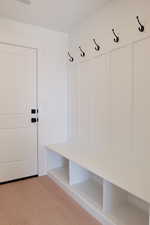 Mudroom with light wood-type flooring