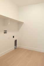 Laundry room with light wood-style flooring, washer hookup, and electric dryer hookup