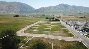 Overview of rural landscape featuring property parcel outlined and mountains