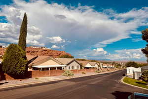 View of asphalt street with curbs and a residential view