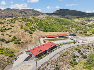Aerial view of property and surrounding area with mountains