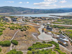 Aerial perspective of suburban area featuring a water and mountain view