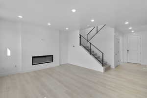 GREAT ROOM W/ RAILING LEADING TO UPSTAIRS! (PICTURE OF PREVIOUS BUILT HOME-COLORS AND MATERIALS MAY VARY)