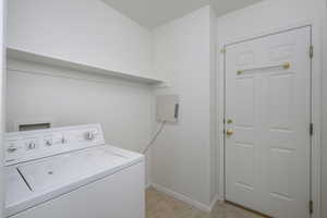 Laundry area featuring washer / clothes dryer and baseboards