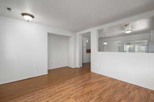 Empty room with wood finished floors and baseboards