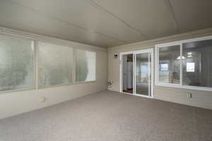 Unfurnished sunroom with plenty of natural light