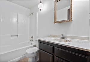 Full bath with shower / tub combination and vanity