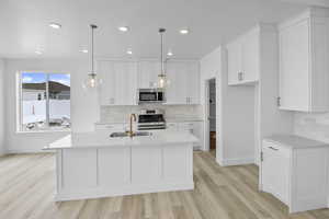 LARGE ISLAND BAR...TILE BACKSPLASH...CABINETS TO THE CEILING! (PICTURE OF PREVIOUS BUILT HOME-COLORS AND MATERIALS MAY VARY)