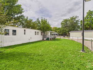 View of yard with a wooden deck