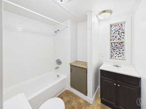 Full bath featuring shower / bathtub combination and vanity