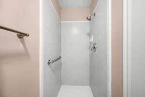 Full bathroom with a shower stall