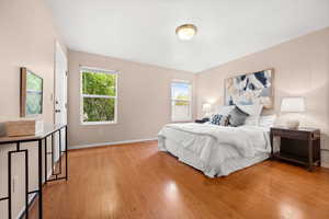 Bedroom featuring light wood finished floors and baseboards
