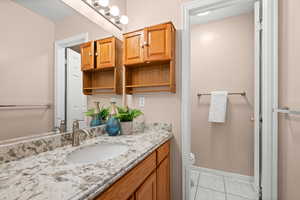 Bathroom with vanity and light tile patterned flooring