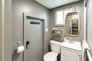 Half bath with vanity and toilet
