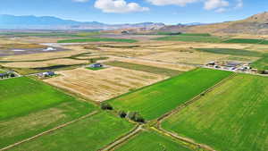 Overview of rural landscape with a mountainous background and abundant farmland