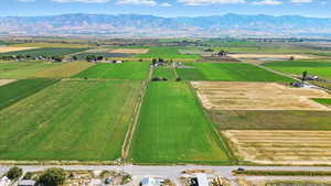 Overview of rural landscape with mountains and rows of crops