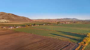 View of mountain backdrop with rural landscape and large plots for crops