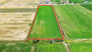 Aerial view of sparsely populated area featuring property parcel outlined