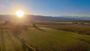 Overview of rural landscape with a mountain backdrop