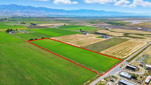 Overview of rural landscape with mountains and property parcel outlined