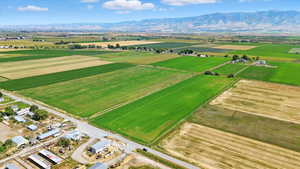 View of rural area featuring abundant farmland and a mountainous background