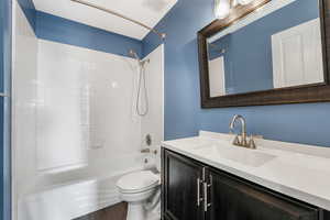 Bathroom with shower / washtub combination and vanity