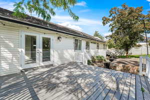 Wooden deck featuring french doors
