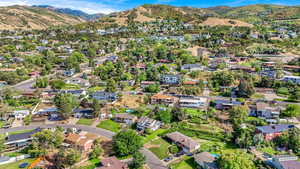 Aerial perspective of suburban area with a mountainous background