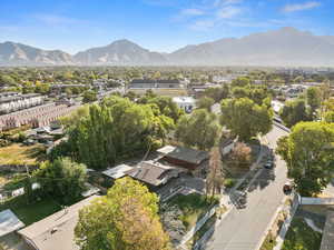 Aerial perspective of suburban area with a mountainous background