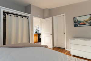 Bedroom with light wood-style flooring and baseboards