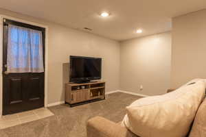Living room featuring carpet floors and recessed lighting