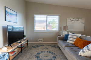 Living area featuring baseboards