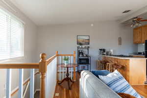 Living room featuring wood finished floors and ceiling fan