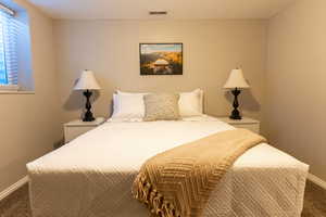 Bedroom with carpet and baseboards