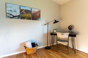 Office area featuring baseboards and wood finished floors