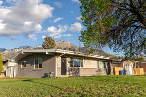 Ranch-style home with brick siding, a mountain view, and crawl space