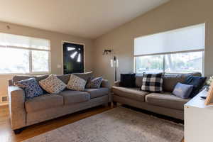 Living room with healthy amount of natural light and wood finished floors
