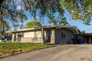 Single story home featuring brick siding