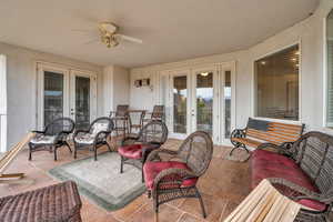 View of patio / terrace with french doors and ceiling fan