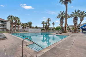 Community pool featuring a patio