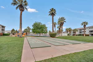 View of home's community featuring shuffleboard