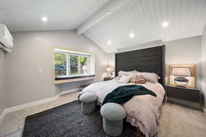 Carpeted bedroom with recessed lighting and a wall unit AC