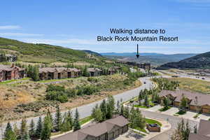 Aerial view of residential area featuring mountains