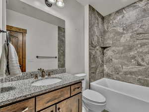 Bathroom with vanity and  shower combination